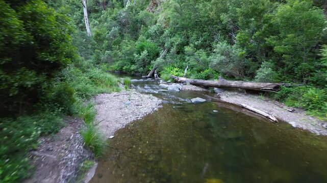 Aerial view moving along creek in Gold country walhalla Australia.