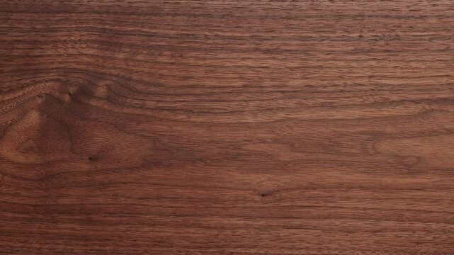 Walnut wood planks texture background. Walnut wood planks panning video texture background. Empty wood planks desktop panning background. Empty desktop.
