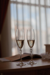 Elegant Champagne Flutes Beside a Softly Lit Window