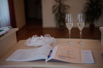 Elegant Wedding Ceremony Setup with Toasting Glasses and Guest Registry
