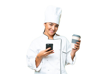 Young woman Chef over isolated chroma key background holding coffee to take away and a mobile