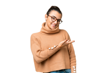 Young beauty woman over isolated chroma key background presenting an idea while looking smiling towards