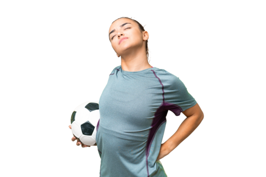Young football player Woman over isolated chroma key background suffering from backache for having made an effort