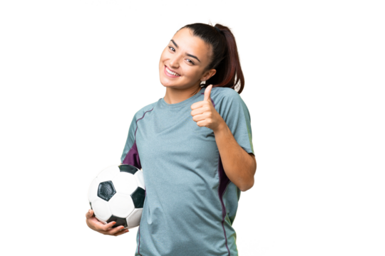 Young football player Woman over isolated chroma key background giving a thumbs up gesture - Powered by Adobe