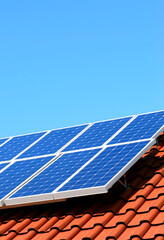 Solar panels and blue sky background.Solar cells farm on the roof.Photovoltaic modules for renewable energy.Save the earth and the energy with good environment concept, doodle art, with white tones