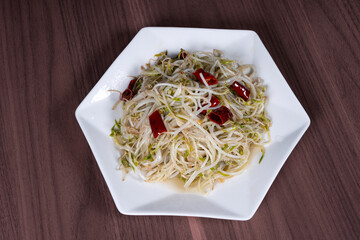 Fried mung bean sprouts on a white China plate