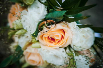 Romantic Wedding Rings on Delicate Floral Arrangement