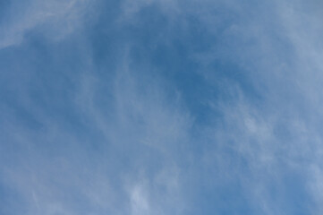 Majestic sky reveals swirling clouds and endless blue on a serene afternoon in early spring