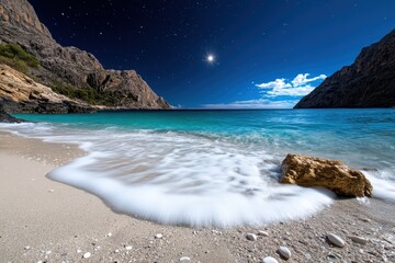 A picturesque moonlit scene of the shore with calm waters, where waves softly crash against the...