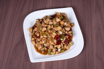 Kung Pao chicken on a white plate