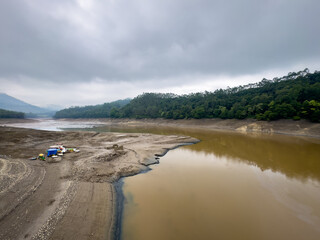 Tour boats over the land due to low water storage in the Kundala dam (also known as Setuparvatipuram Dam), built on Muthirapuzha River, Idukki district in Kerala, India.