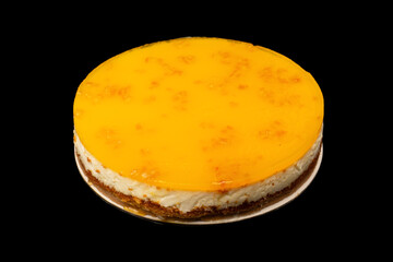 Orange cheesecake isolated on a white background.