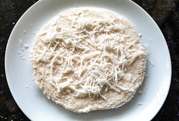 Traditional Brazilian tapioca with coconut served on a banana leaf. Amazonian tapioca