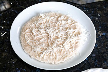 Traditional Brazilian tapioca with coconut served on a banana leaf. Amazonian tapioca