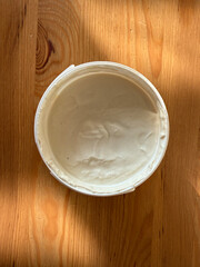 Cashew cream cheese with nuts and crackers, vegan dairy alternative close-up