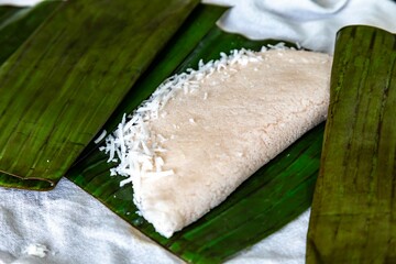 Traditional Brazilian tapioca with coconut served on a banana leaf. Amazonian tapioca