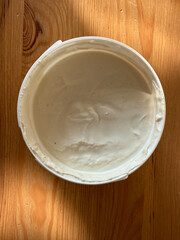 Cashew cream cheese with nuts and crackers, vegan dairy alternative close-up