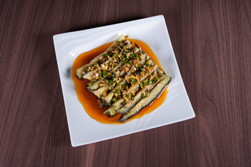 Eggplant salad on a white plate