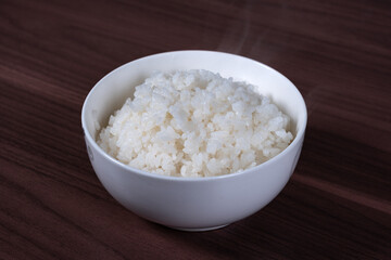 Long white rice in a white porcelain bowl