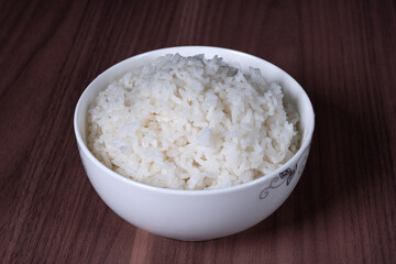 Long white rice in a white porcelain bowl