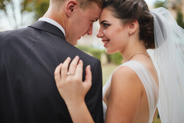 Close-Up of Bride and Groom Holding Bouquet