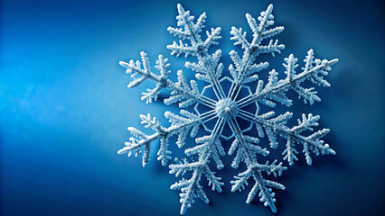 Abstract Blue Background Decorated with White Snowflake Motifs