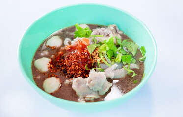 Noodle in a green bowl isolated on a white background with clipping path. Asian and Chinese style fast food concept.