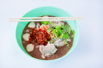 Noodle in a green bowl isolated on a white background with clipping path. Asian and Chinese style fast food concept.