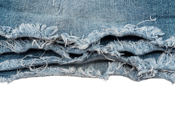 Piece of torn denim on a white background. Denim texture