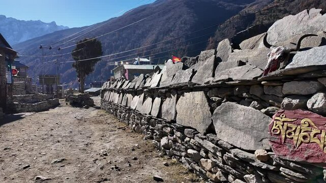Manaslu, Nepal: Point of view of a trekker walking toward the Samdo village along the Manaslu circuit in the Himalayas in Nepal. 