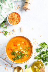 Red lentil soup, traditional asian food with ingredients. Flat lay.