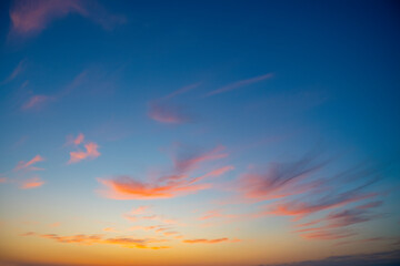 Blue sky at sunset. Pink and yellow horizon. Romantic travel background with empty space for text.