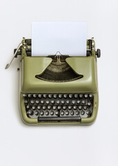 Old-fashioned details in the office. Vintage typewriter on bright background.