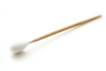 a single cotton swab on a white surface