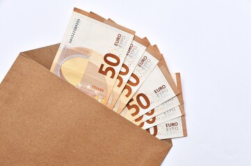 Paper money, 50 Euro cash notes in an envelope
