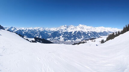 Breathtaking Snowy Landscape with Majestic Mountains Under Clear Blue Sky