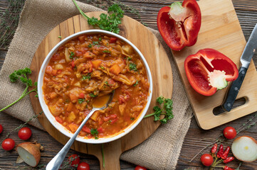 Healthy vegetable soup with red lentils and cabbage on a plate