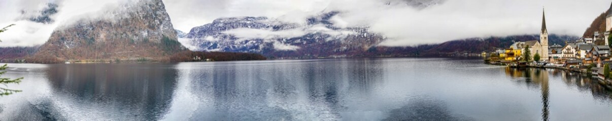 Historic Hallstatt, Austria. Beautiful lakeside village with colorful houses and stunning mountain views. Picturesque village in the Salzkammergut region. UNESCO site. Panoramic Photo
