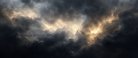 Obraz premium Dramatic dark clouds with light breaking through.