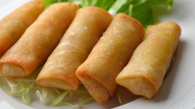 Spring rolls on a plate on  table