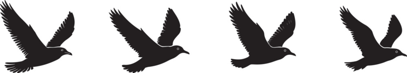 Four Black Birds in Flight Across the Sky