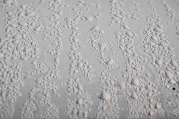 Water condensation, dew on metal surfaces, drops on the car body.