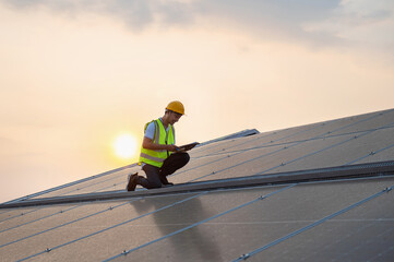 man in a yellow vest is working on a solar panel