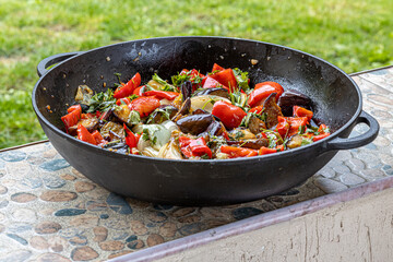 Grilled vegetable salad with zucchini, eggplant, onion, pepper and tomato