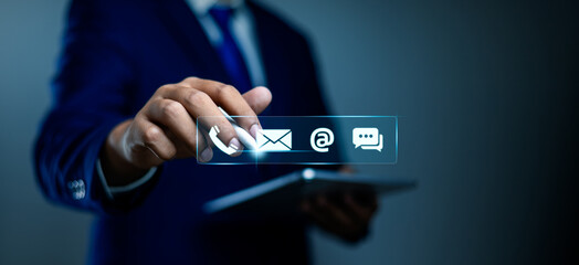 Contact Us concept, Businessman touching on virtual screen icons for email, phone, address, and live chat assistance to support digital customer services, Digital contact service, Online support.