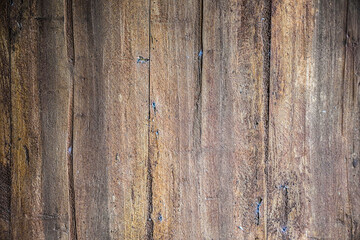 Cracked old solid wooden board. Detail natural background texture.