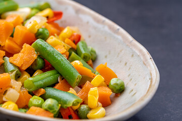 Mexican Mix of Vegetables. Tomatoes, Green Beans, Peas, Corn. Dietary Food.Bright vegetable mix .Vegetarian food.Assorted.