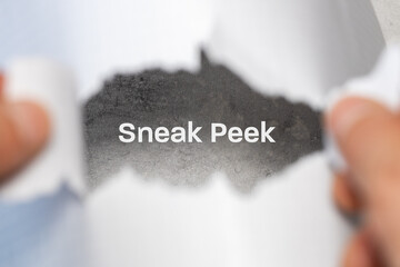 Slogan Sneak Peek seen through a hole in a torn piece of paper. Conceptual sneak peek symbol. Copy...