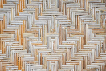 Texture of traditional woven bamboo or woven rattan wood. Concept for eco green building wall.