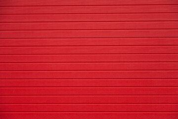 Red horizontal striped texture.  Perfect background for design projects, websites, or presentations. Clean and simple aesthetic.